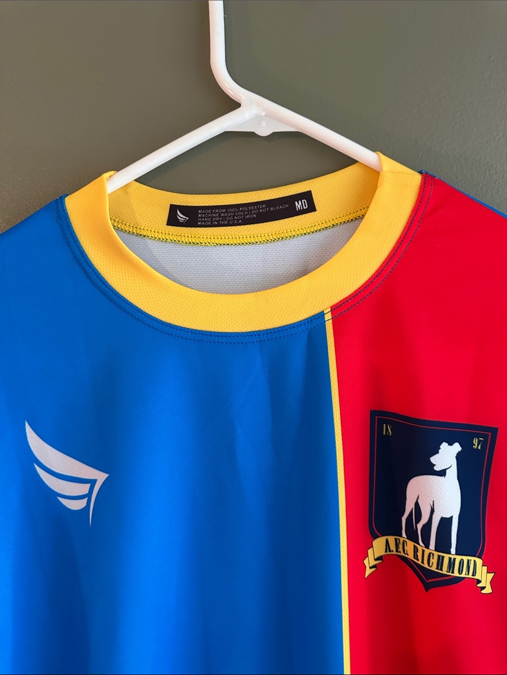 Ted Lasso Blue and Red Athletic Jersey with Yellow Trim - Picture 3 of 4